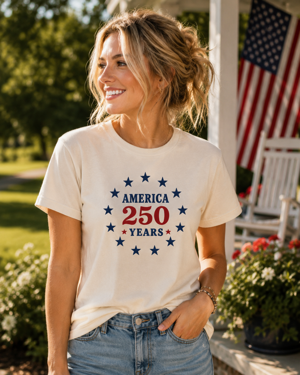 Woman wearing a t-shirt with 'America 250 Years' design outdoors.